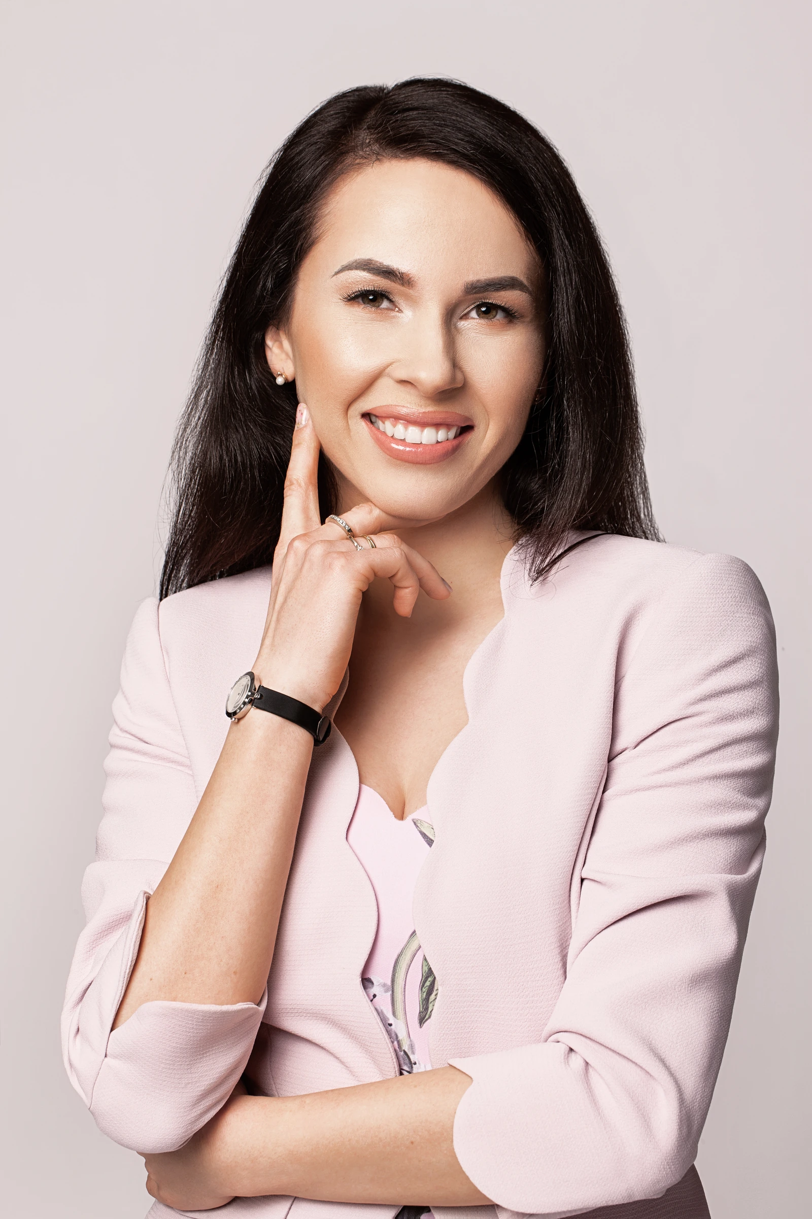 Jurate Auk, co-founder of Mantas Auk LLC, in a light pink blazer.